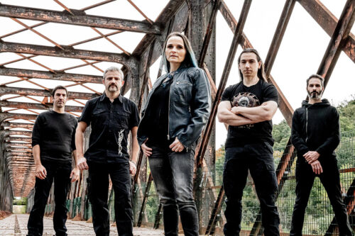 Band photo of Bullet Ride standing on a bridge looking very metal.